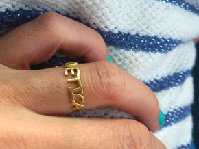 The Helvetica ring  (Size K, 50). in Natural Brass