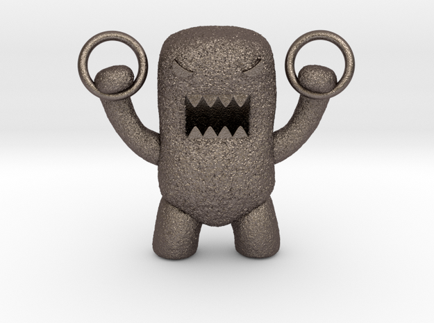 Domo Monster doing exercises with rings