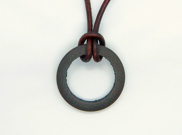 Ring shaped pendant with a raw band inside in Matte Black Steel