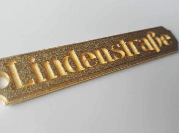 LINDENSTRAßE keychain in Polished Gold Steel