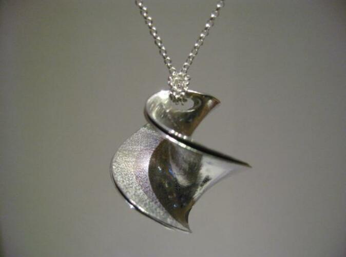 Pendant assembled, with added silver chain.