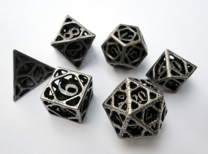 Cage Dice Set 3d printed In stainless steel and inked.
