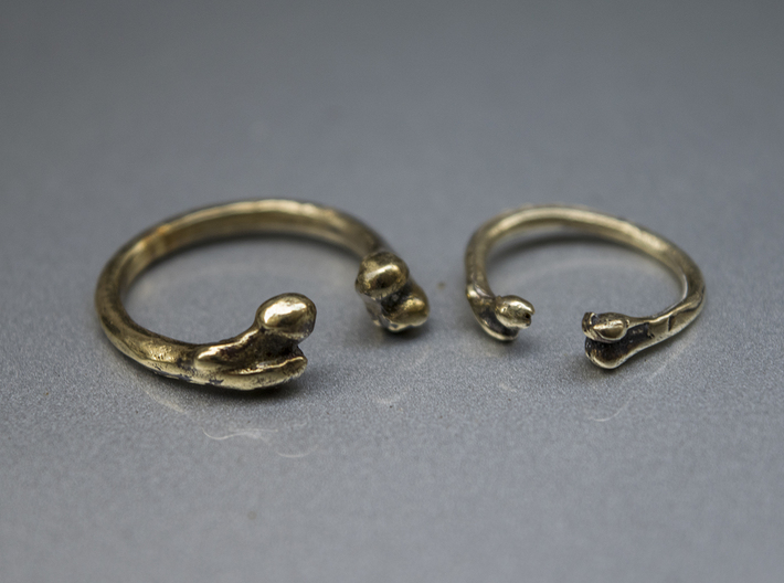 Bone adjustable Ring (Woman size) 3d printed Male (http://shpws.me/LIMM)  and female bone ring in brass