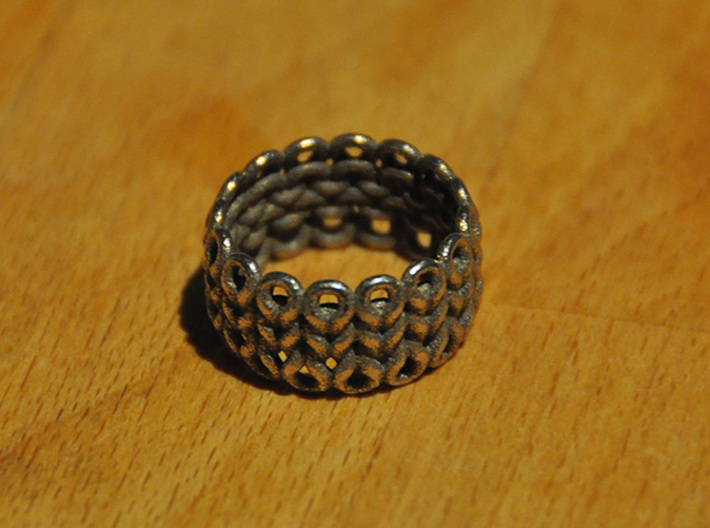 Knitter's Ring (59mm) 3d printed The ring in stainless steel. This model came from Shapeways with a bit of residue stuck in the cracks between stitches. I removed the excess material with a needle.