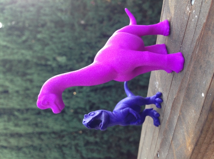 Brachiosaurus Chubbie Krentz 3d printed pictured in polished purple strong and flexible, next a royal blue Allosaurus.
