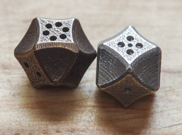 Futuristic Die 3d printed 2 of the dice printed: Left is Polished Bronze Steel and right is Stainless Steel.