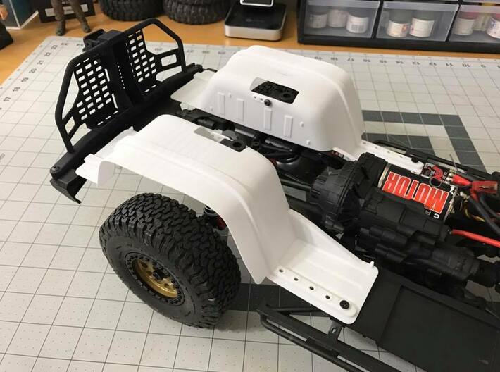 AC10005 SCX10 II XJ body Inner Fender REAR 3d printed Shown fitted to the SCX10 II chassis (sold separately). Final parts come in black.