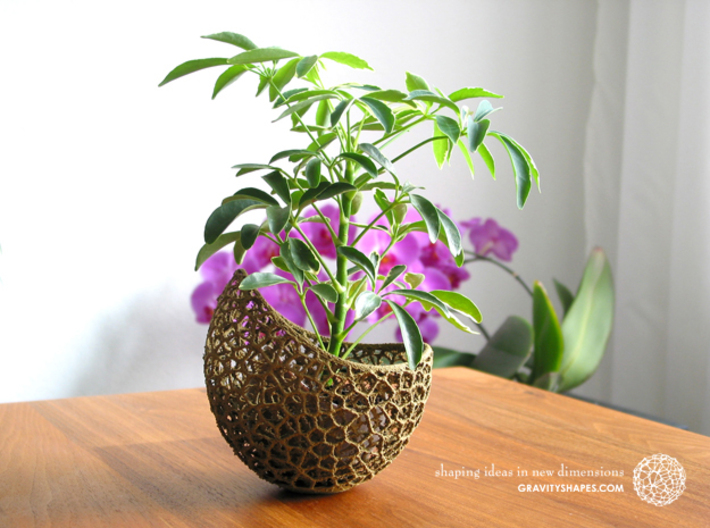 A burgeoning capsule Planter with small Pot 3d printed Own 3D-print of a 2-color version with Wood and brown PLA.