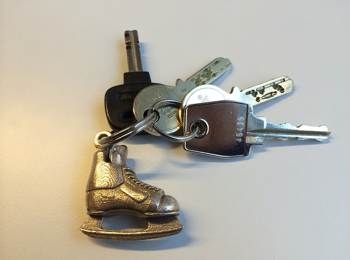 Keychain-Hockey-Skate 3d printed The Hockey Skate printed in Stainless Steel attached to a key chain.