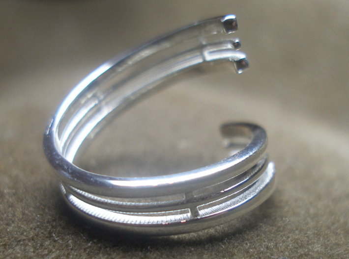  Bar And Center Wire Ring Size 10 3d printed Photo of the ring on a ring stand, printed in sterling silver.  