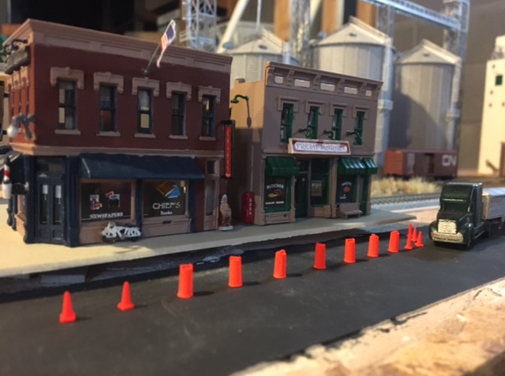 'HO Scale' - Road Construction Cones and Barrels 3d printed Working on the curb to raise the existing road.