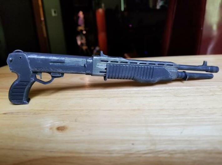 SPAS 12 1:4 scale shotgun without pump 3d printed SPAS-12 model in frosted ultra detail, hand painted. Size shown is 1:4 scale. The moveable pump can be purchased separately.