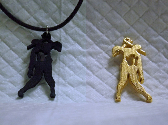 Spike The Zombie Pendant 3d printed Black Strong & Flexible and Polished Gold Steel versions.