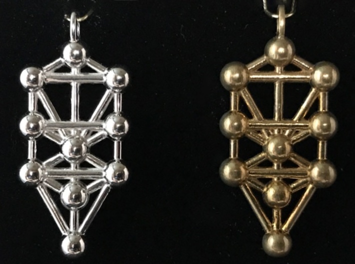 Tree Of Life Pendant 3d printed For comparison, the rhodium-plated polished pendant on the left, and the unpolished (raw) brass pendant on the right. 