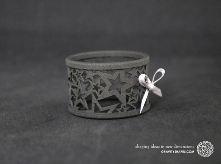 Set of 4 large Christmas napkin rings with Stars 3d printed The photo shows a print made of black strong and flexible incl. silver lacing.