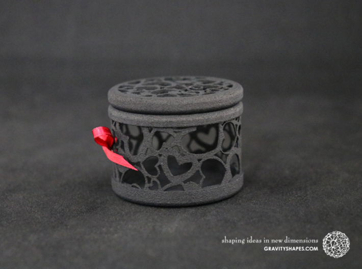 Gift Box round No. 1 with Hearts (filigree, short) 3d printed The photo shows a print made of black strong and flexible incl. red lacing.