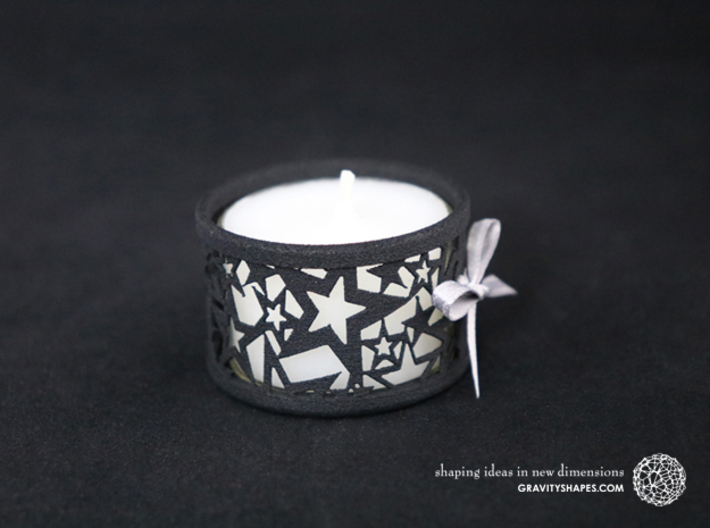 Set of 2 small tealight holders with Stars 3d printed The photo shows a print made of black strong and flexible incl. silver lacing and a high 8h tealight candle.