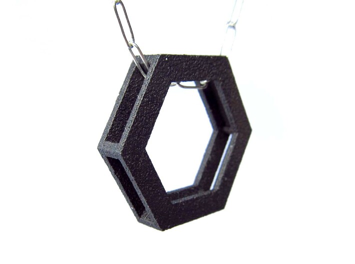 Simple Hexagon Pendant 3d printed The sides are hollow to allow the chain to pass through.