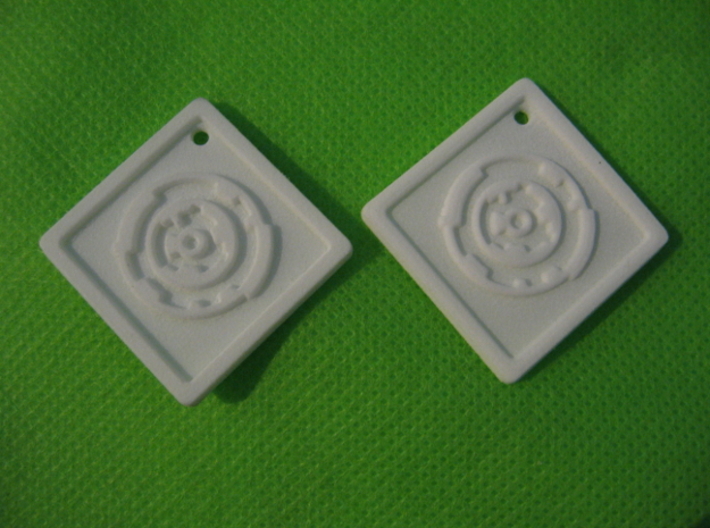 Revision Key Fob 3d printed Photos of actual prints in White Strong and Flexible and White Strong &amp; Flexible Polished (right).