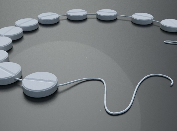 Pill Shaped Beads that Can be strung as Beads 3d printed Here is a 3D rendering of a bracelet being strung together