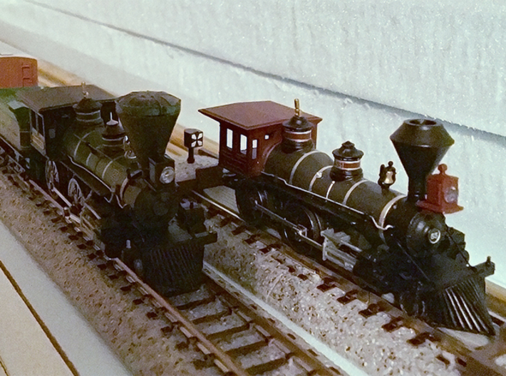N-Scale Locomotive 'Bonnet' Stack (Single) 3d printed A stock Atlas 4-4-0 stationed next to the William Mason with printed ‘bonnet’ stack (left).