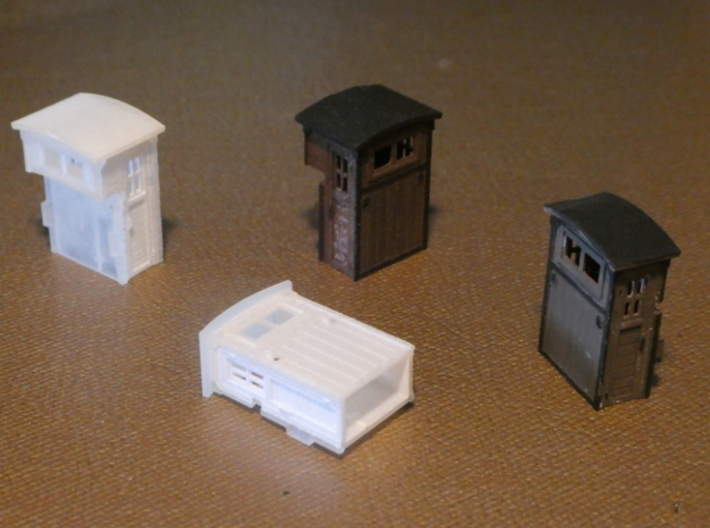 HO Brakeman's Cab Replacement Set 3d printed "Large"-style cabins are to the rear-- "small"-style cabins are in the front.  Each size variation includes two cabins.  Paint gives a weathered look.