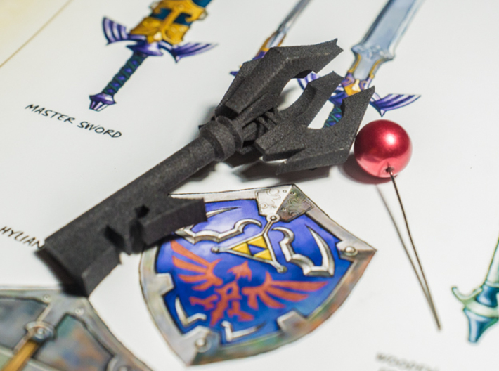Zelda Twilight Princess Boss Key (see description) 3d printed Printed Product next to a proper bead