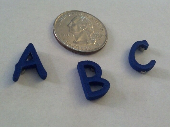 Comic Sans Alphabet Magnets 3d printed A, B, anc C (quarter included for scale).