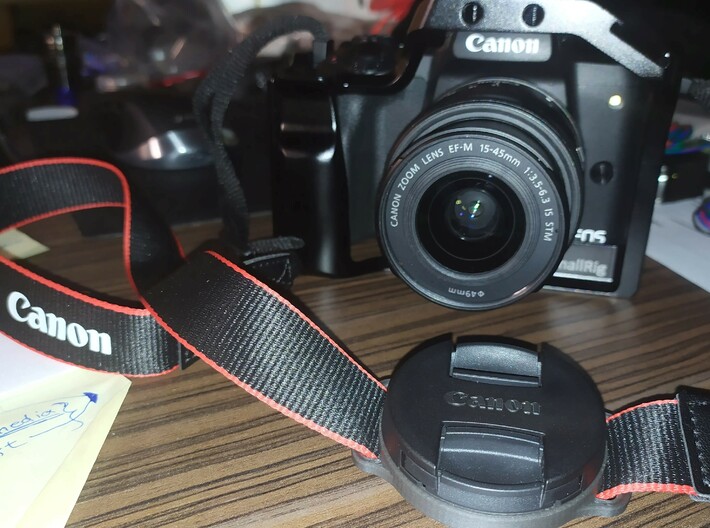 Canon M50 strap mount cap holder for 49mm lens cap 3d printed 