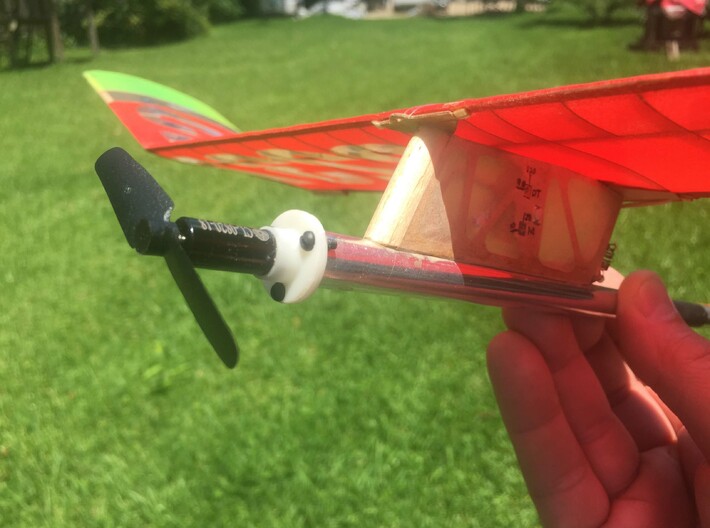 E20_Motor_Mount 3d printed The mount is designed for a 4mm carbon tube fuselage, but easily adapts to other applications. The photo shows the mount on a Salt Peanuts E-20 with a fuselage made from an F1B tailboom.  It also easily mounts to a balsa "noseblock."