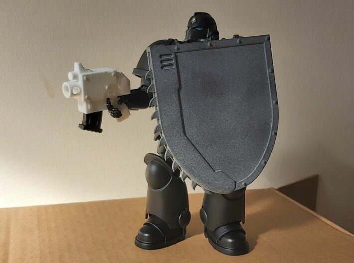 Action Figure Chainshield - Left Handed 3d printed Printed in Grey PA12, held by a 1:12 scale action figure, along with  an Action Figure Bolt Pistol