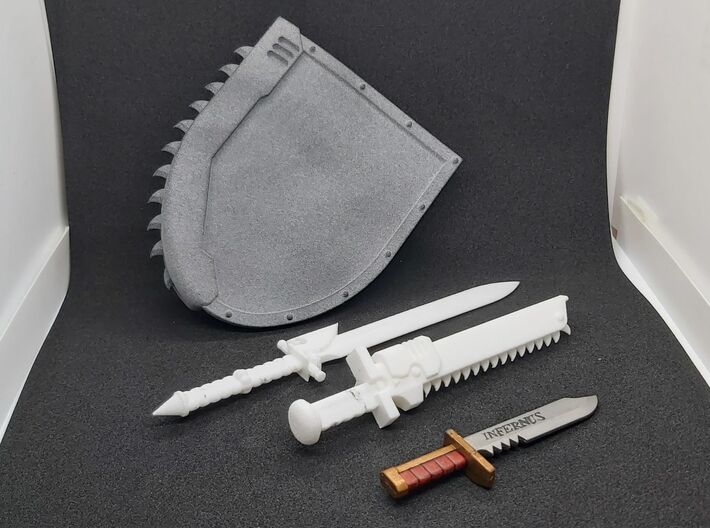 Action Figure Chainshield - Right handed 3d printed Left handed version, printed in Grey PA12, compared to Action Figure Powersword, Action Figure Chainsword and Combat Knife from an action figure