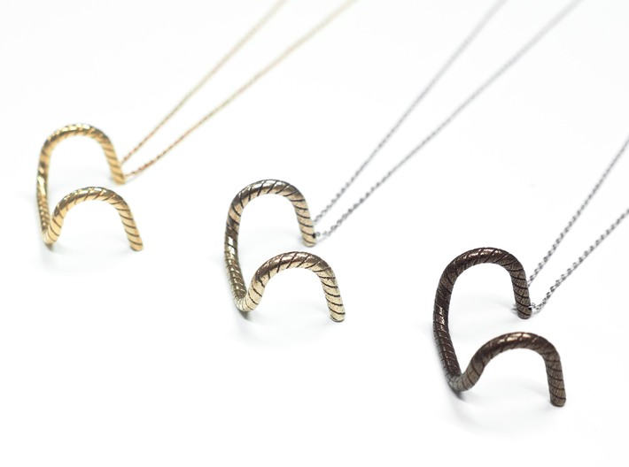 Detour Handlebar Necklace 3d printed Left to right; Polished Brass, Steel, Bronze steel