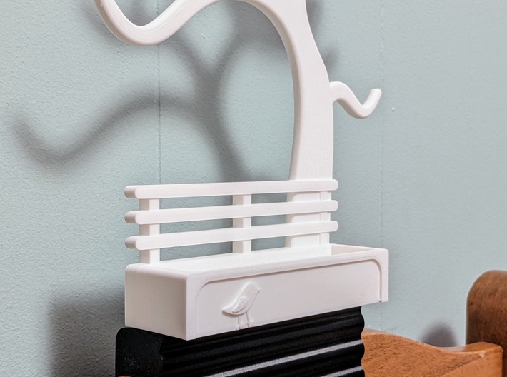 Wavy Headboard-Mount Base for Jewelry Tree Holder 3d printed Shapeways nylon prints will be smoother, but here's a sample of a prototype print in PLA. It's also a slightly larger scale, but gives an idea of how it works.