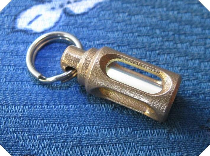 Tritium Pendant 2 (3x11mm Vials) 3d printed In this picture the phosphorus coating on the tritium vial being energised by UV light.