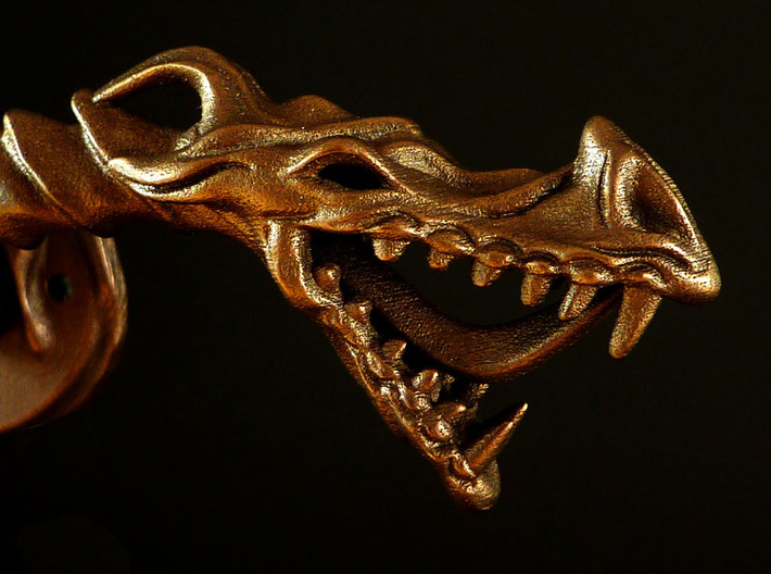 Dragon doorhandle 005 3d printed dragon doorhandle no.5 - 3D print in matte bronze steel. Detail of dragons head