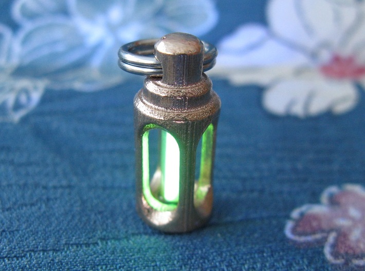 Tritium Earrings 3 (3x11mm Vials) 3d printed In this picture the phosphorus coating on the tritium vial is being energised by UV light.