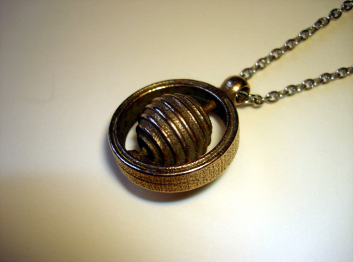 Spinning Top Pendant 3d printed Photo of an actual printed item (chain not included)