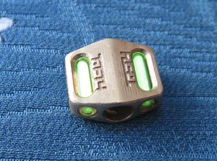 Pedal Bead Ver.3: Tritium (Pandora Thread) 3d printed In this picture the phosphorus coating on the tritium vial is being energised by UV light.