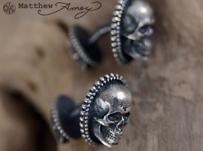 Skull cuff link - 25mm 3d printed Raw silver that I applied a patina to. I then hand-polished off the patina.
