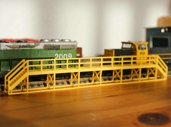 N Scale Train Maintenance Platform SINGLE STAIR LE 3d printed Train maintenance platform with two stairs in Yellow Strong &amp; Flexible Polished, straight of the box. NB: the model in the picture differs from the one on this page.