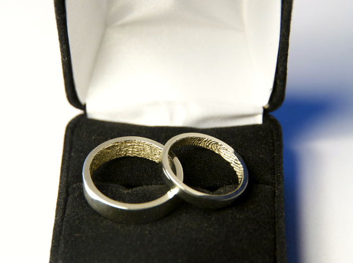 Fingerprint Ring - Hers 3d printed The matching pair of rings: the 3mm "hers" and the 5mm "his" in 14k White Gold.