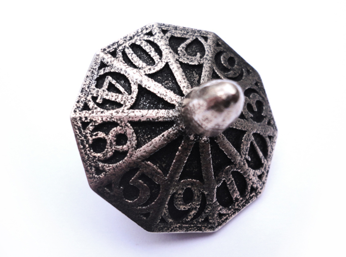 Top d10 3d printed In stainless steel and inked.