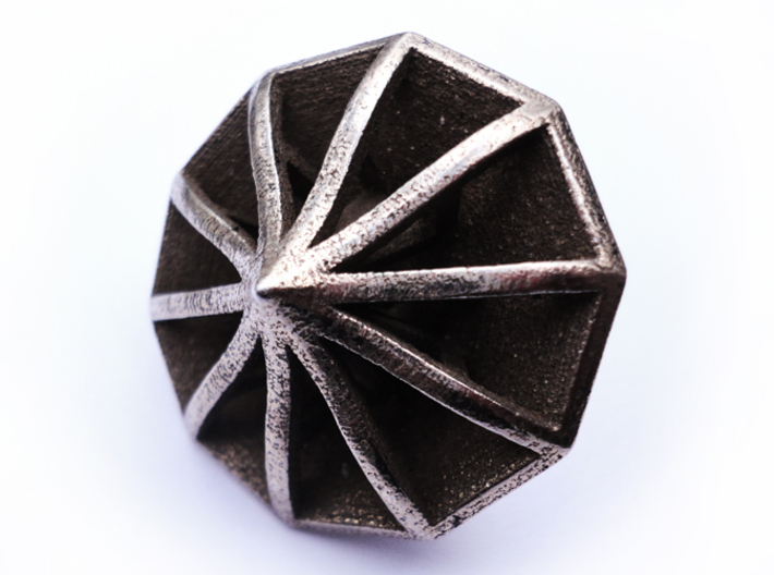 Top d10 3d printed In stainless steel and inked.