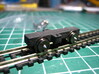 N rolonderstel voor dummy SIK NS 200-300 locomotor 3d printed WSF zwart gespoten met metalen wielsetjes (puntjes van de asjes nog niet afgeslepen)