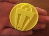 Tomorrowland Pin 3d printed In yellow.