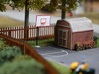 HO Scale Basketball Hoop 3d printed The painted basketball hoop in a backyard scene. Thanks for the picture Rob!