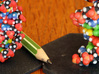 DNA Molecule Model Upright 3d printed Left uncoated Full Color Sandstone (size Standard), right Coated Full Color Sandstone (size Large).