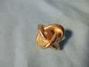Unusual twisted D8 (rings) 3d printed This is a picture of the 40mm variant in polished gold steel.