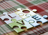 Puzzle Piece E - "Love-letters" 3d printed 4 puzzle pieces combined to write the word "love".